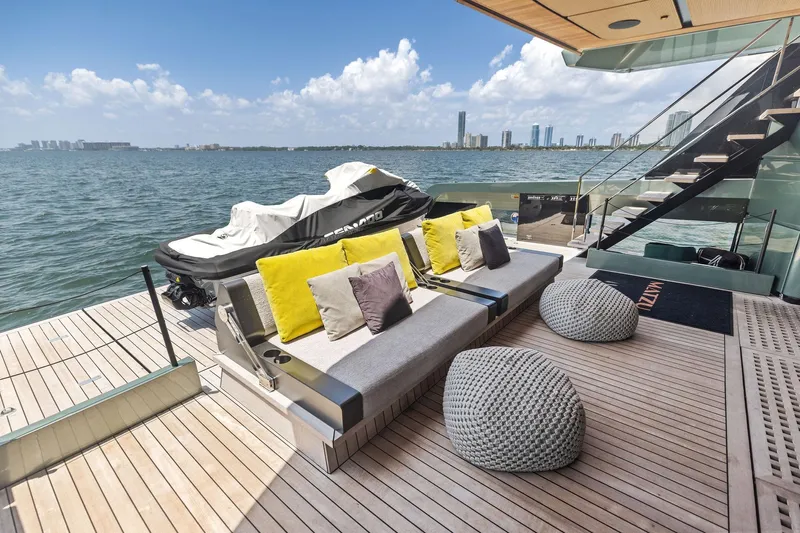 Matzu II Yacht Photos Pics Luxurious 2023 Wally WHY 150 yacht deck with seating, cushions, and sea view.