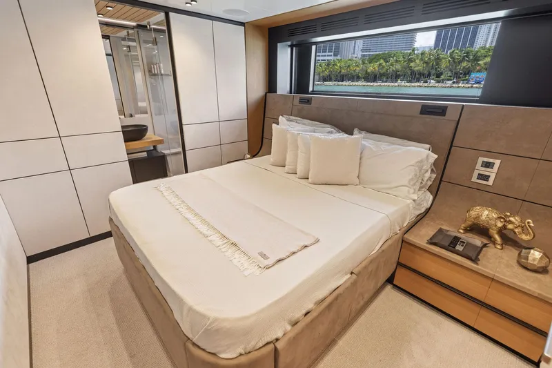 Matzu II Yacht Photos Pics Luxurious bedroom interior of 2023 Wally WHY 150 yacht with elegant decor and scenic window view.