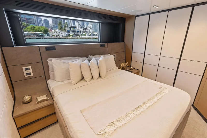 Matzu II Yacht Photos Pics Luxurious bedroom interior of 2023 Wally WHY 150 yacht with scenic window view.