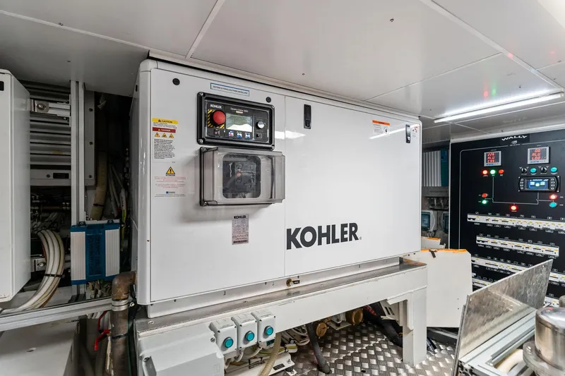 Matzu II Yacht Photos Pics Engine room of 2023 Wally WHY 150 yacht featuring Kohler generator and control panels.