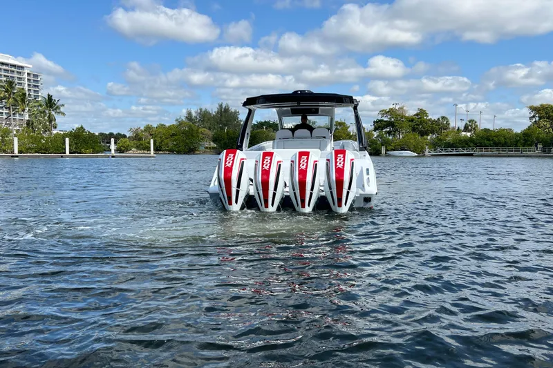  Yacht Photos Pics 2025 Cigarette 41 Nighthawk boat with quad engines on a sunny day.