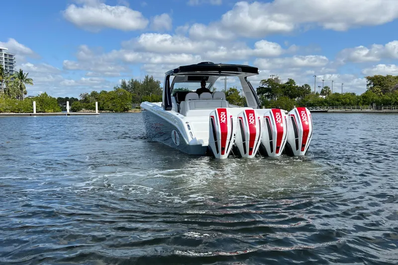  Yacht Photos Pics 2025 Cigarette 41 Nighthawk boat with four powerful engines on a sunny day.