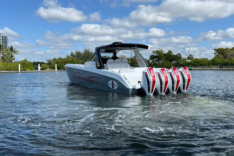  Yacht Photos Pics 2025 Cigarette 41 Nighthawk boat with quad engines on a sunny day.