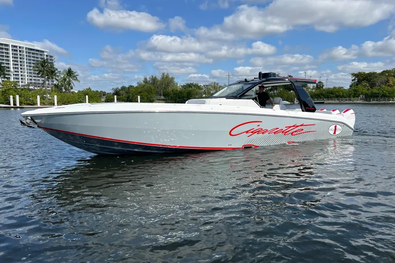  Yacht Photos Pics 2025 Cigarette 41 Nighthawk boat on water, sleek design, clear sky background.