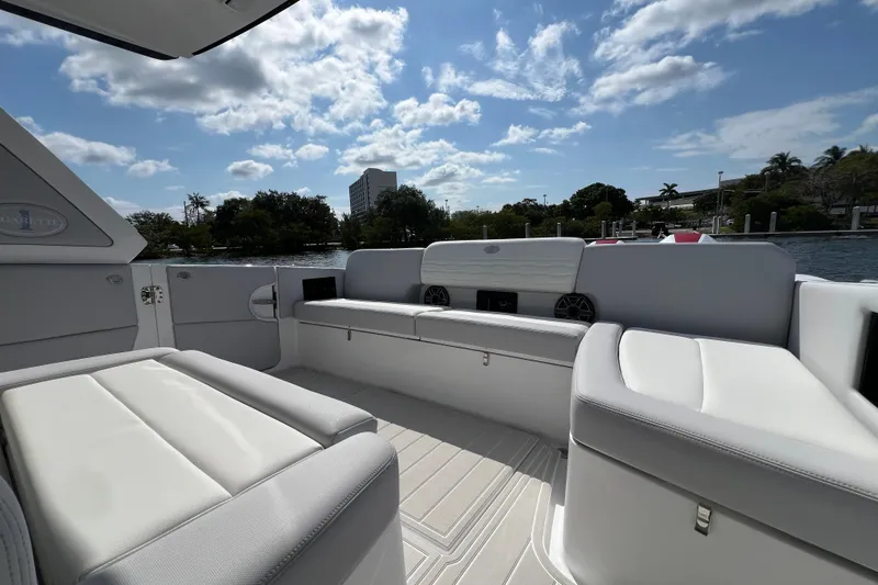  Yacht Photos Pics 2025 Cigarette 41 Nighthawk boat interior with luxurious seating and scenic water view.