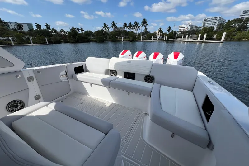  Yacht Photos Pics 2025 Cigarette 41 Nighthawk boat interior with luxurious seating and scenic waterfront view.