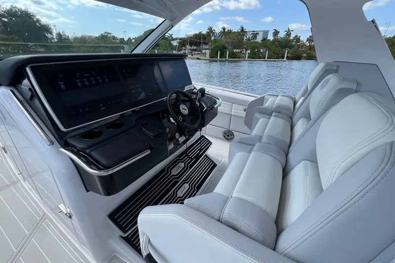  Yacht Photos Pics Interior of 2025 Cigarette 41 Nighthawk boat with modern dashboard and luxurious seating.