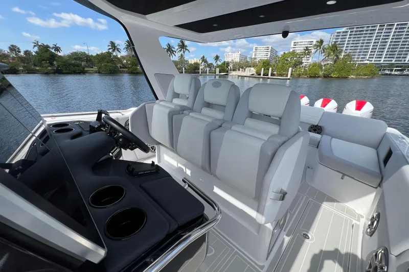  Yacht Photos Pics 2025 Cigarette 41 Nighthawk boat interior with luxurious seating and modern dashboard.