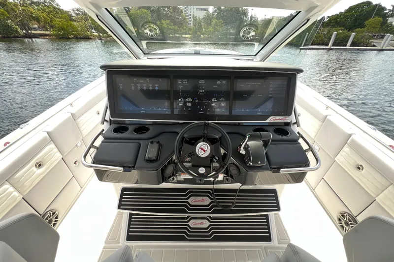  Yacht Photos Pics 2025 Cigarette 41 Nighthawk boat cockpit with advanced navigation screens and controls.