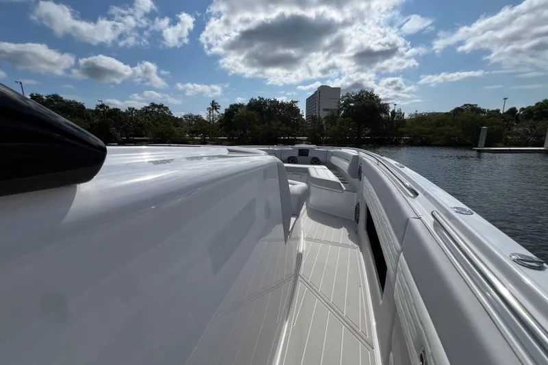  Yacht Photos Pics 2025 Cigarette 41 Nighthawk boat deck under a partly cloudy sky.