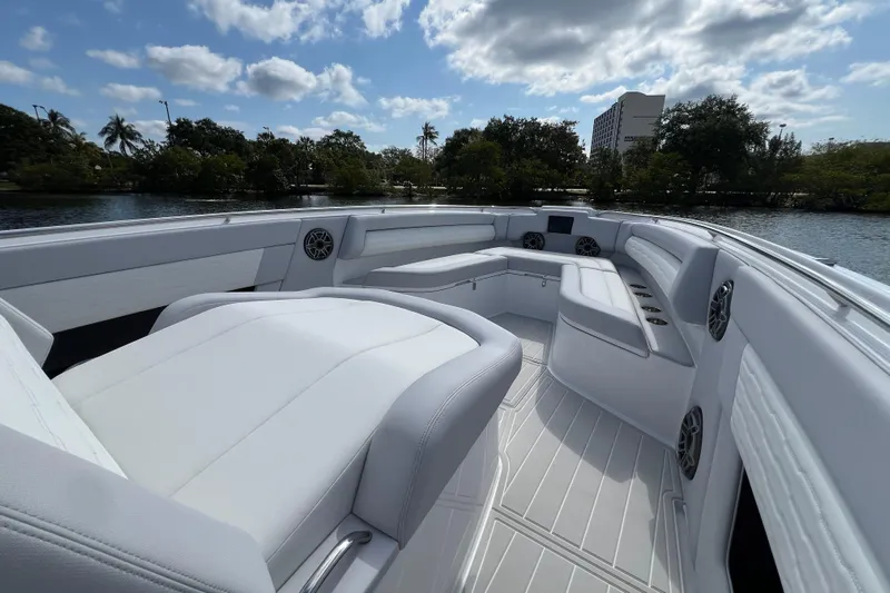  Yacht Photos Pics 2025 Cigarette 41 Nighthawk boat interior with luxurious white seating and scenic water view.