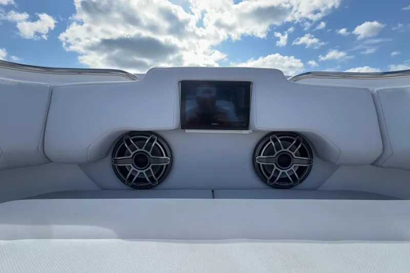  Yacht Photos Pics 2025 Cigarette 41 Nighthawk boat interior with speakers and display screen under blue sky.