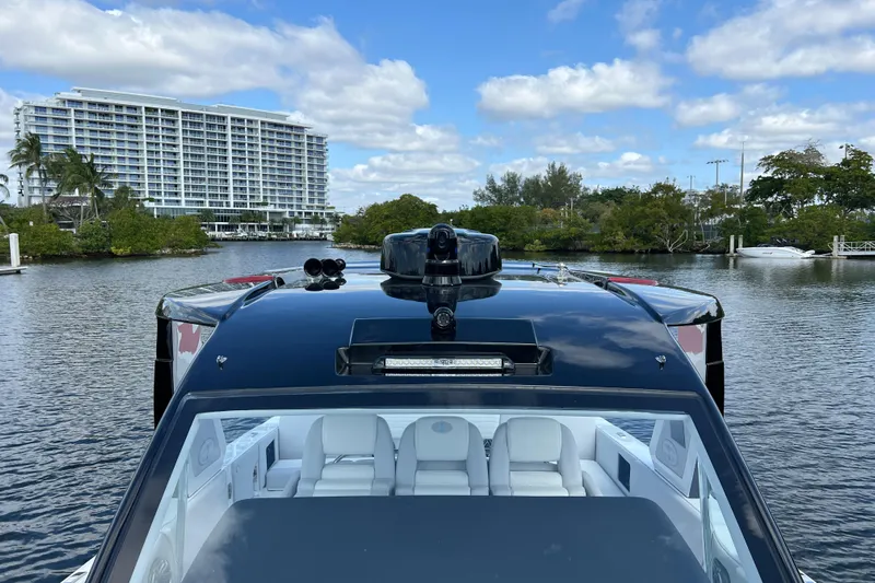  Yacht Photos Pics 2025 Cigarette 41 Nighthawk boat on water, modern design, luxury interior, scenic background.