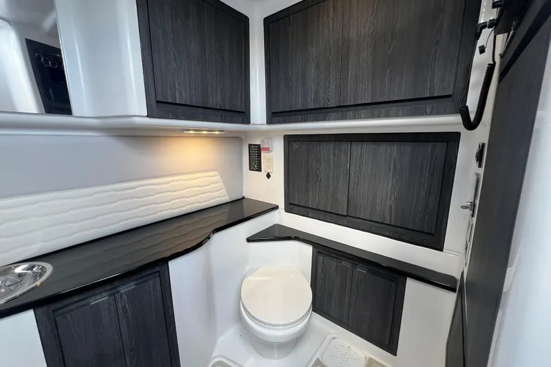  Yacht Photos Pics Luxurious 2025 Cigarette 41 Nighthawk boat interior with sleek cabinetry and modern amenities.