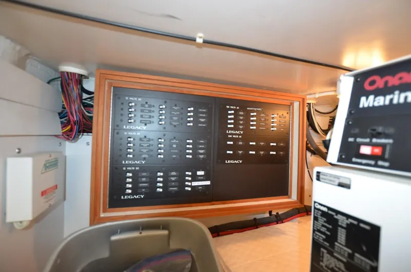 O Henry Yacht Photos Pics Electrical panel inside 2006 Legacy Yachts Sedan, showcasing wiring and control systems.