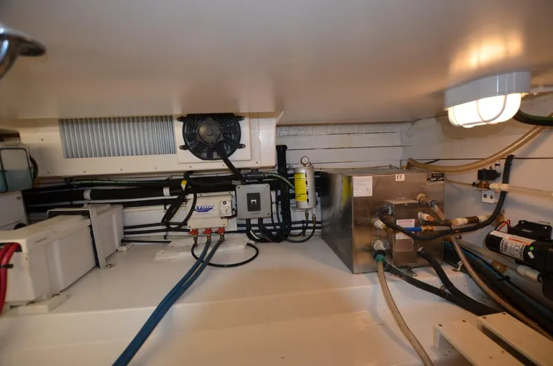 O Henry Yacht Photos Pics Engine room of 2006 Legacy Yachts Sedan, featuring wiring and mechanical components.