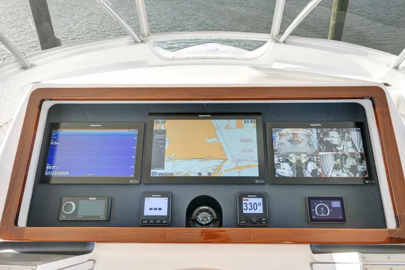 Desparado Yacht Photos Pics 2019 Viking 68 Convertible yacht dashboard with navigation and monitoring screens.