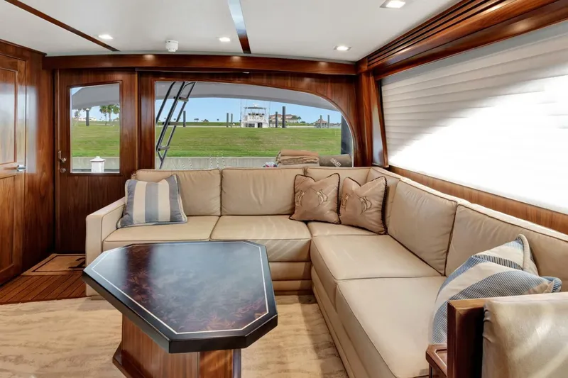 Desparado Yacht Photos Pics Luxurious interior of 2019 Viking 68 Convertible yacht with plush seating and elegant wood finishes.