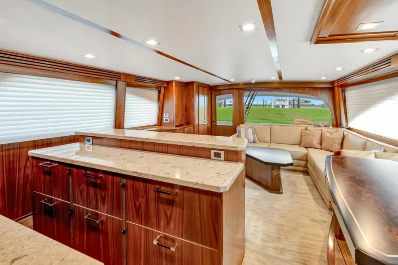 Desparado Yacht Photos Pics Luxurious interior of 2019 Viking 68 Convertible yacht with elegant wood finishes and plush seating.