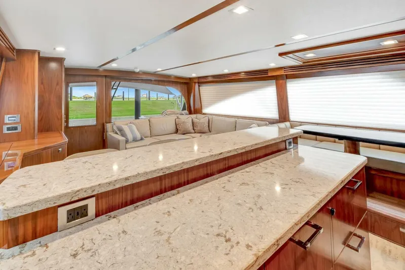 Desparado Yacht Photos Pics Luxurious interior of 2019 Viking 68 Convertible yacht with elegant wood and marble finishes.