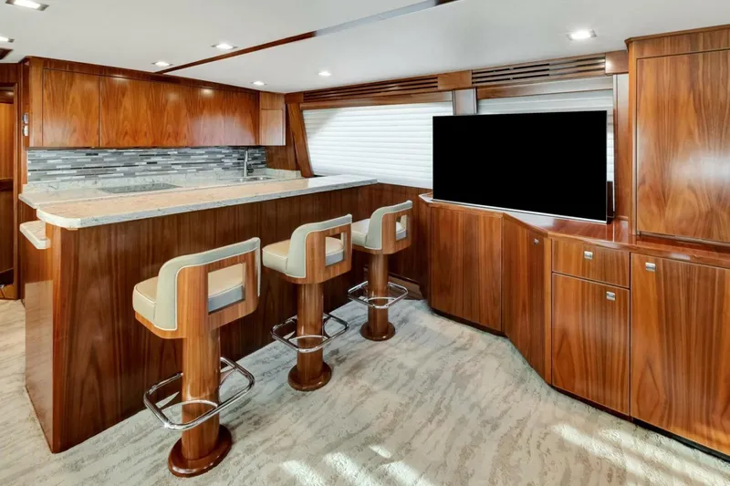 Desparado Yacht Photos Pics Luxurious interior of 2019 Viking 68 Convertible yacht with elegant wood finishes and modern amenities.
