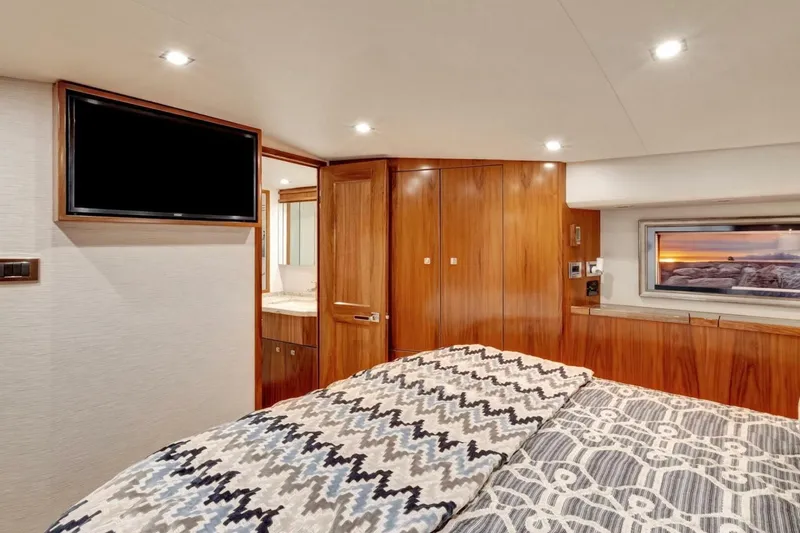 Desparado Yacht Photos Pics Luxurious cabin interior of 2019 Viking 68 Convertible yacht with wood paneling and modern amenities.