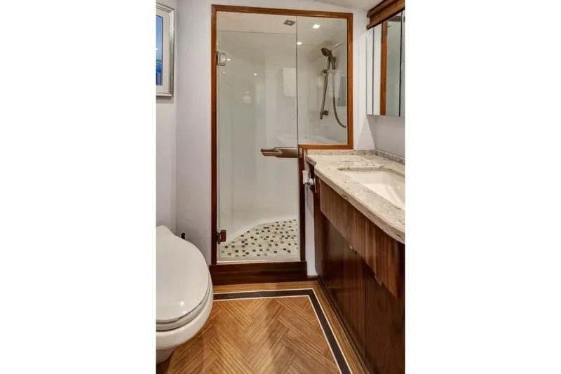 Desparado Yacht Photos Pics Luxurious bathroom in 2019 Viking 68 Convertible yacht with shower and elegant wood finishes.