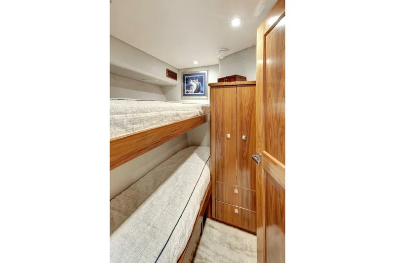 Desparado Yacht Photos Pics 2019 Viking 68 Convertible yacht cabin with bunk beds and wooden cabinetry.