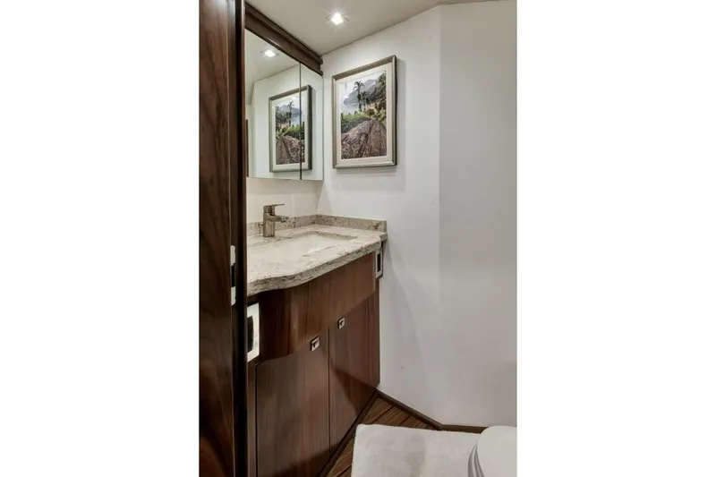 Desparado Yacht Photos Pics Luxurious bathroom in 2019 Viking 68 Convertible yacht with elegant wood cabinetry.