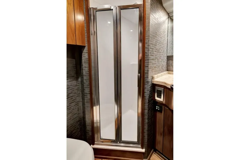 Desparado Yacht Photos Pics Luxurious bathroom interior of 2019 Viking 68 Convertible yacht with sleek shower design.