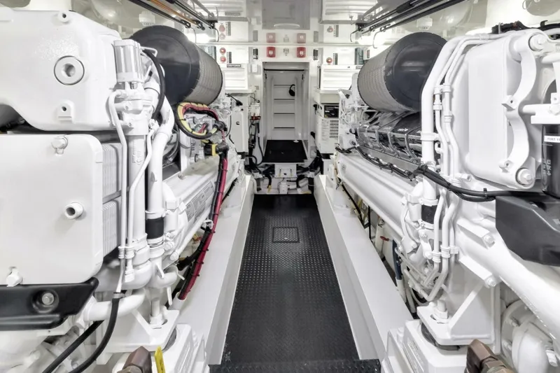 Desparado Yacht Photos Pics Engine room of 2019 Viking 68 Convertible yacht, showcasing dual engines and mechanical systems.