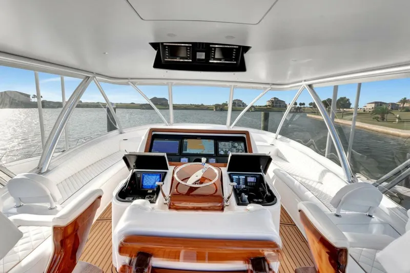 Desparado Yacht Photos Pics 2019 Viking 68 Convertible yacht helm with advanced navigation systems and luxurious seating.