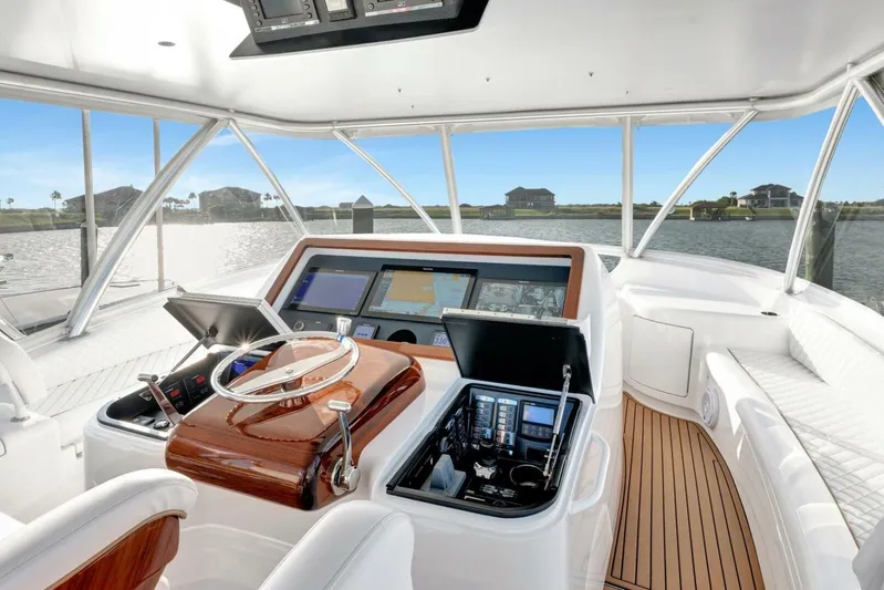 Desparado Yacht Photos Pics Interior view of 2019 Viking 68 Convertible yacht cockpit with advanced navigation systems.