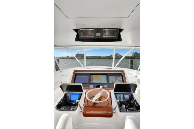Desparado Yacht Photos Pics 2019 Viking 68 Convertible yacht helm with advanced navigation displays and controls.