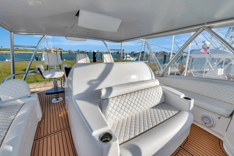 Desparado Yacht Photos Pics Luxurious interior of 2019 Viking 68 Convertible yacht with white quilted seating.