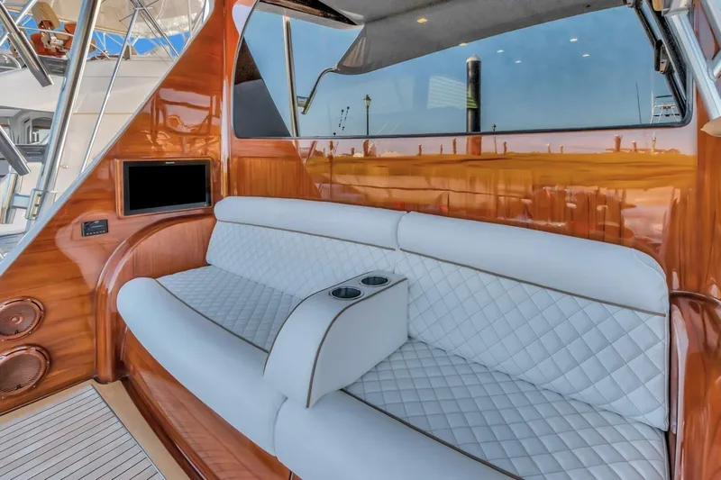 Desparado Yacht Photos Pics Luxurious interior of 2019 Viking 68 Convertible yacht with plush seating and wood accents.