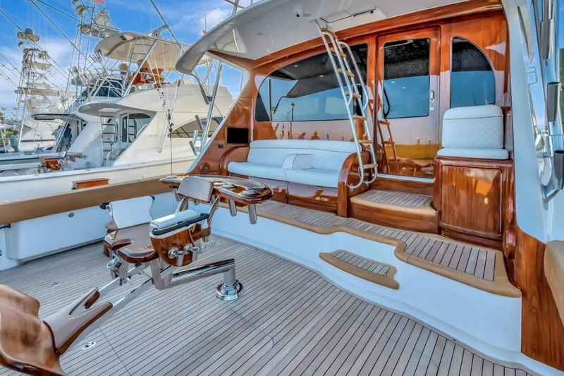 Desparado Yacht Photos Pics Luxurious 2019 Viking 68 Convertible yacht interior with polished wood and seating area.