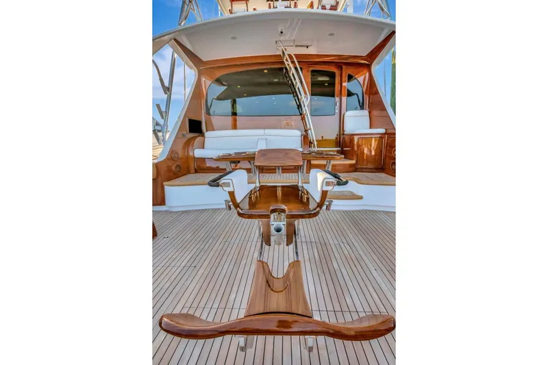 Desparado Yacht Photos Pics Luxurious 2019 Viking 68 Convertible yacht with elegant wooden deck and seating area.