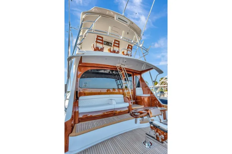 Desparado Yacht Photos Pics 2019 Viking 68 Convertible yacht with elegant wood finishes and spacious seating area.