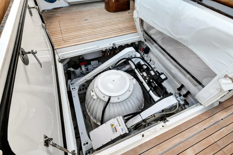 Desparado Yacht Photos Pics Engine compartment of 2019 Viking 68 Convertible yacht with advanced machinery and wooden deck.