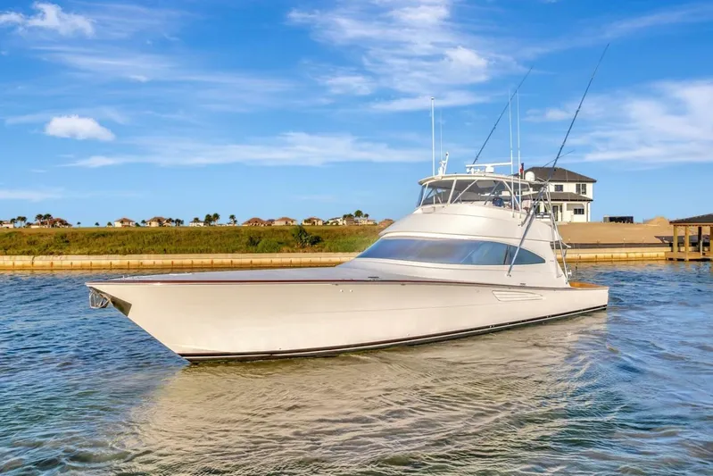 Desparado Yacht Photos Pics 2019 Viking 68 Convertible yacht on calm water, clear sky background.