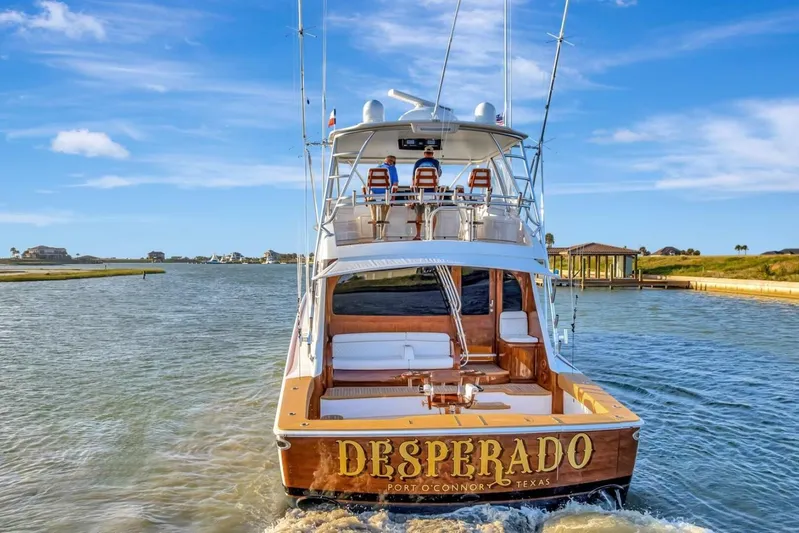 Desparado Yacht Photos Pics 2019 Viking 68 Convertible yacht "Desperado" cruising in sunny waters, rear view.