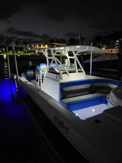  Yacht Photos Pics 2011 Motion Marine 42 boat illuminated at night, docked with blue accent lighting.