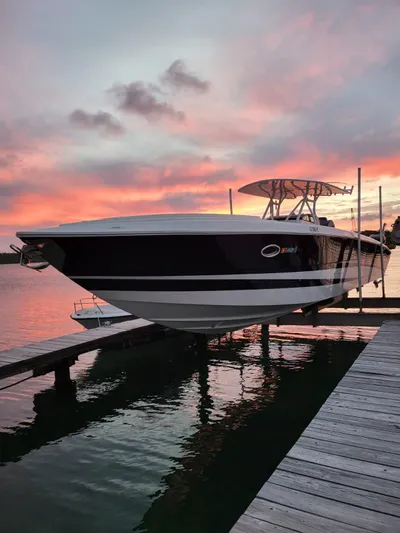  Yacht Photos Pics 2011 Motion Marine 42 boat docked at sunset with vibrant sky reflections.