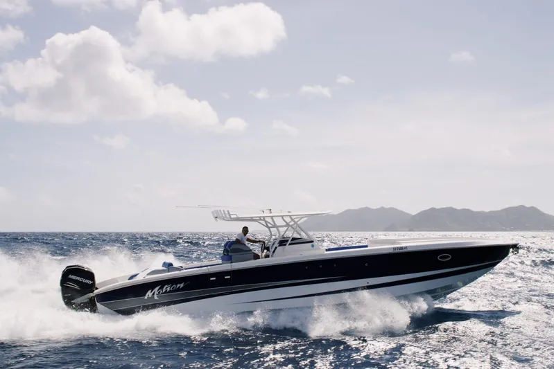  Yacht Photos Pics 2011 Motion Marine 42 boat cruising on open water under a clear sky.