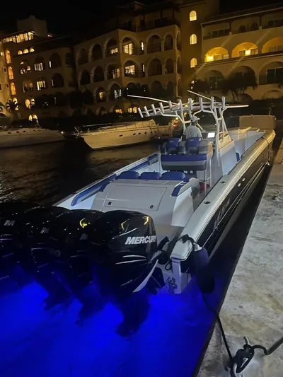  Yacht Photos Pics 2011 Motion Marine 42 boat docked at night with blue underwater lights.