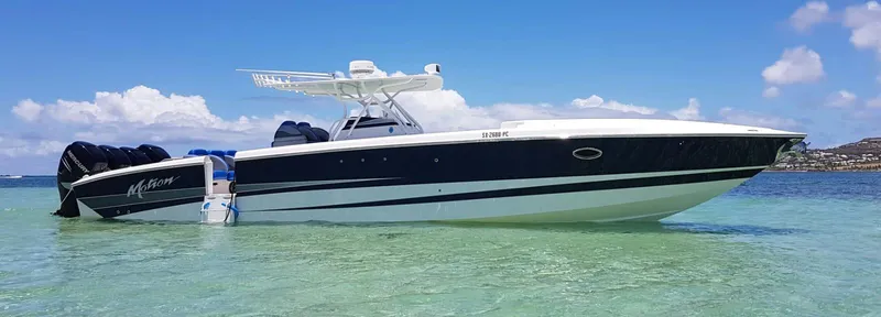  Yacht Photos Pics 2011 Motion Marine 42 boat in clear turquoise water under blue sky.