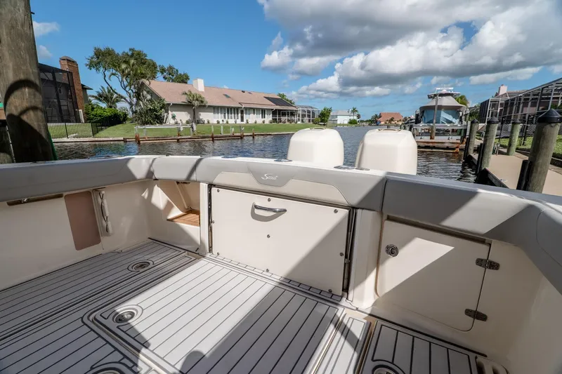  Yacht Photos Pics 2019 Scout 320 LXF boat interior with scenic waterfront view.
