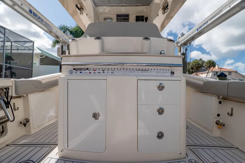  Yacht Photos Pics 2019 Scout 320 LXF boat interior with storage compartments and seating.