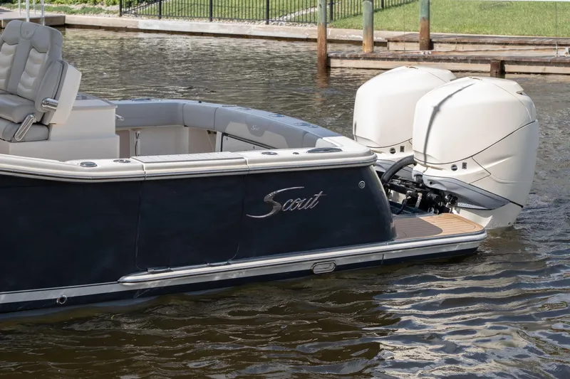  Yacht Photos Pics 2019 Scout 320 LXF boat with dual outboard engines on water.